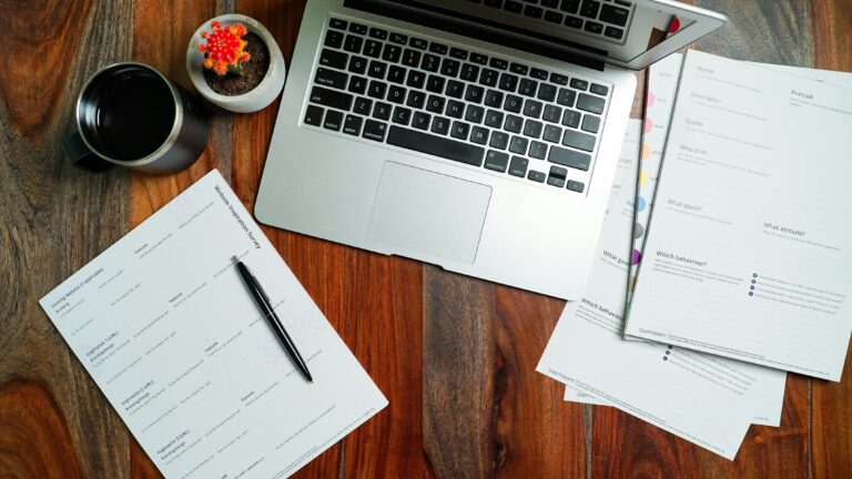 picture of a desk with a lot of paperwork that's not using assettrac asset management software to ditch paperwork and spreadsheets for accurate asset registers.