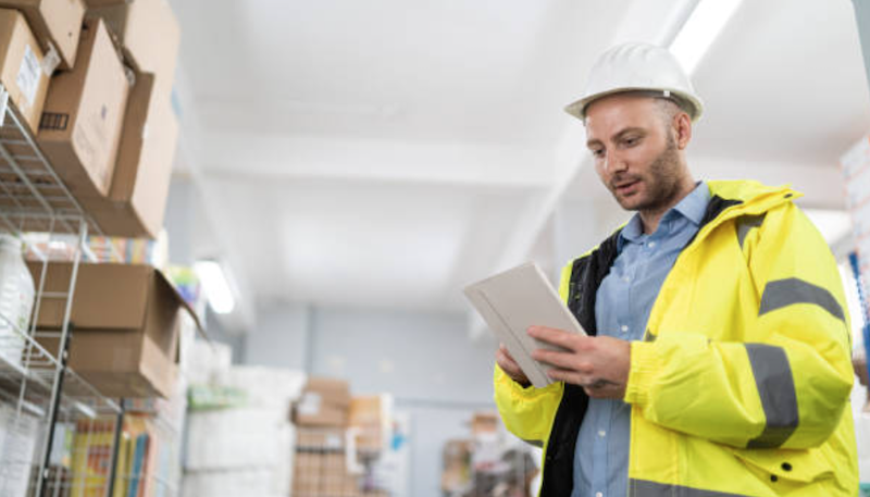 Man doing an asset audit using industrial asset management software by Assettrac. Also used in manufacturing